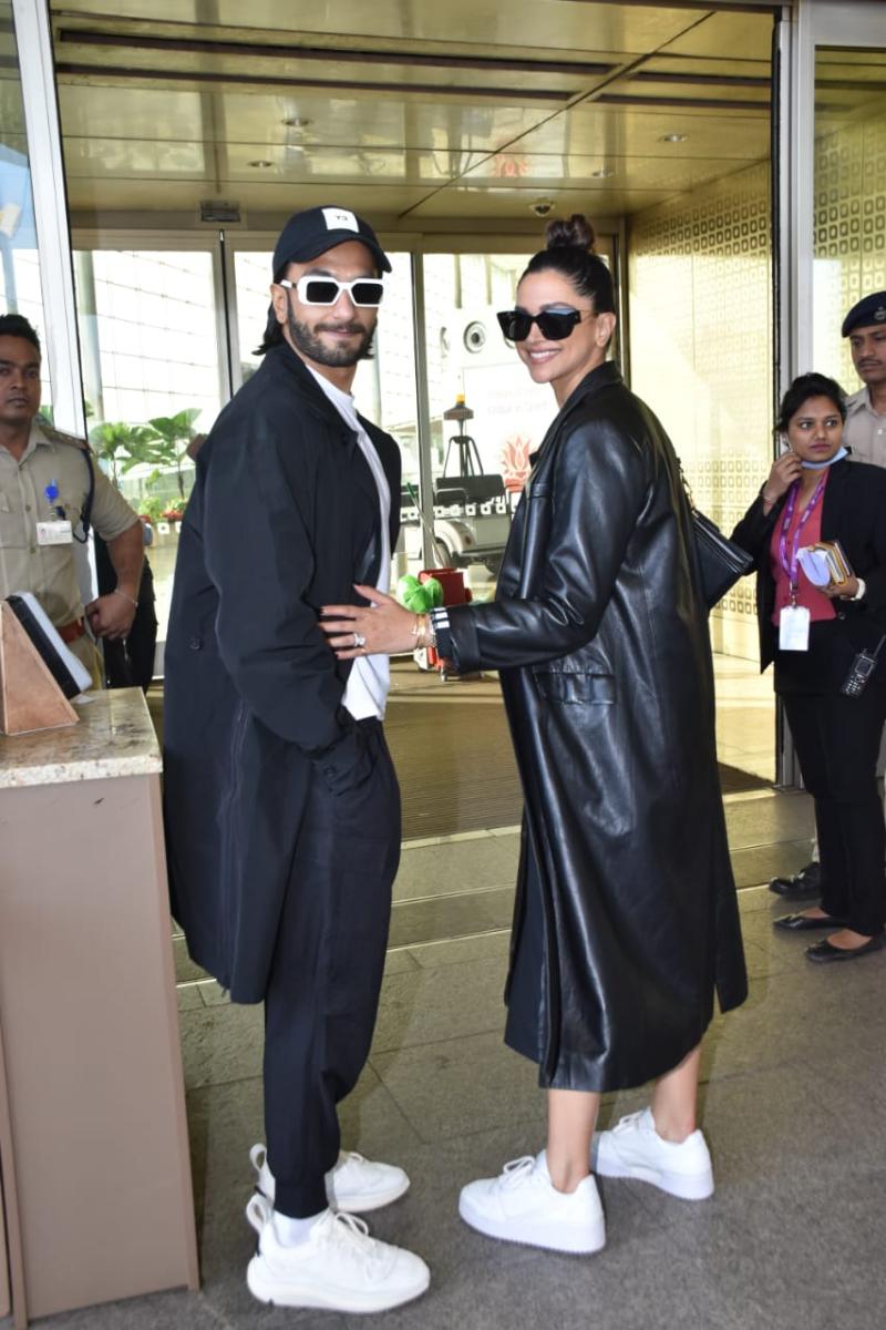 Before heading to the airport, the couple paused to pose for the shutterbugs. While Deepika flashed a big smile, Ranveer kept a low profile and only smirked at the cameras.